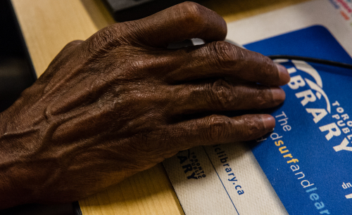 Senior hand at computer class Senior hand at computer class