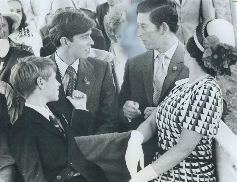 Prince Charles sitting next to other Princes and Queen