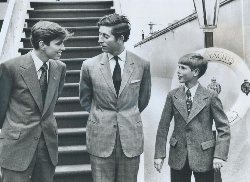 Prince Charles on boat with two younger relatives on either side
