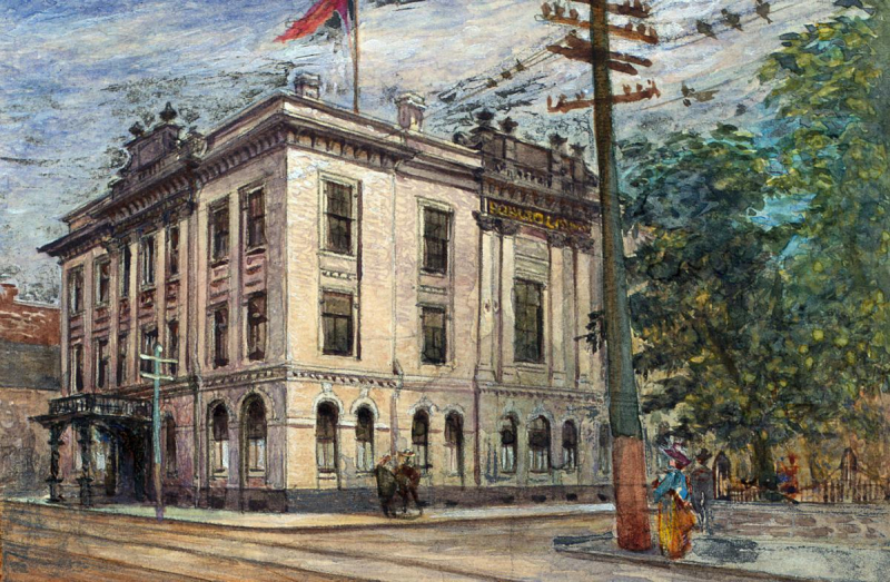 Vibrantpainting of large corner building with three storeys in a vintage town