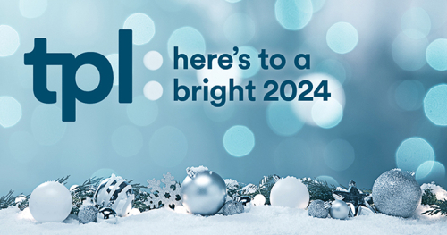 A blue and silver holiday backdrop featuring the Toronto Public Library logo and the words “Here’s to a bright 2024.” A blue and silver holiday backdrop featuring the Toronto Public Library logo and the words “Here’s to a bright 2024.”