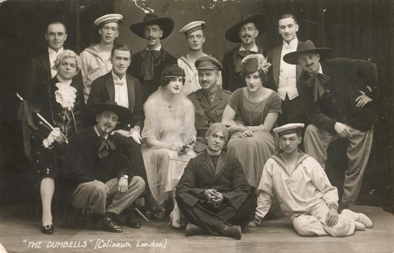 Portrait of men dressed in drag and various costumes