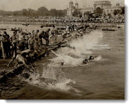 All in at once for the big C.N.E. Swim, Splash. 80 men plunge for the 10-mile marathon swim. 1937