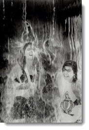 Cool pastime: Kelly Hood, 23, left, and Roisin Cadieux, 23, both of Toronto, find some relief from yesterday's heat under a fountain at the Ex. 1990