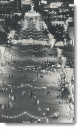 The bustle and activity of the Canadian National Exhibition is never more noticeable or colorful than at night as this picture at the Midway last night indicates