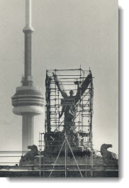 Falling angel: Scaffolding surrounds the angel atop the Princes' Gate at Exhibition Place, put up after consultants found substantial damage from age and pollution. 1987
