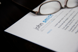 Eyeglasses on top of a resume page
