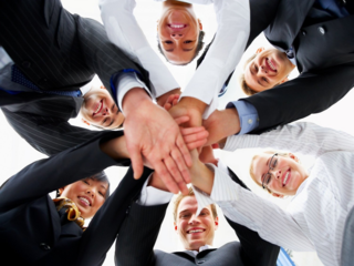 Teamwork and team spirit - Hands piled on top of one another