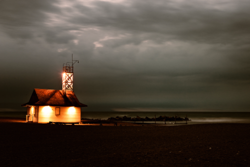 Lifeguard station with a grey, stormy sky behind it