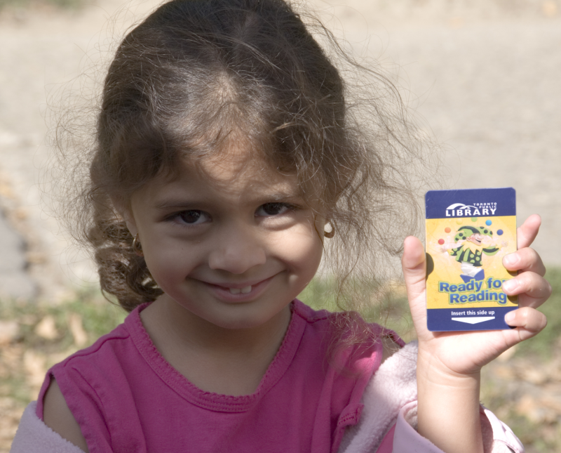 Child with library card