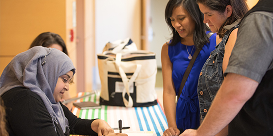 S. K. Ali signs books for fans