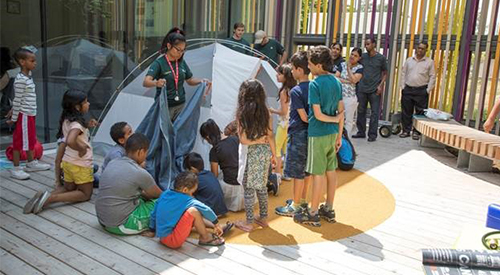 Families learn to pitch a tent at Albion library