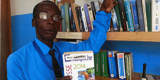 Julien in his library holding a book from TPL