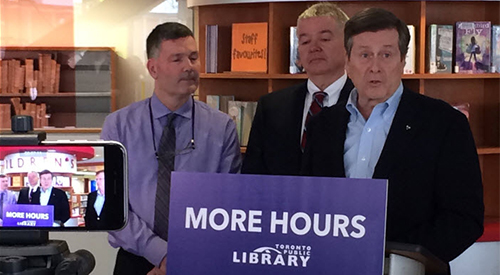 Somebody and Paul Ainslie with John Tory at Cedarbrae Branch press conference