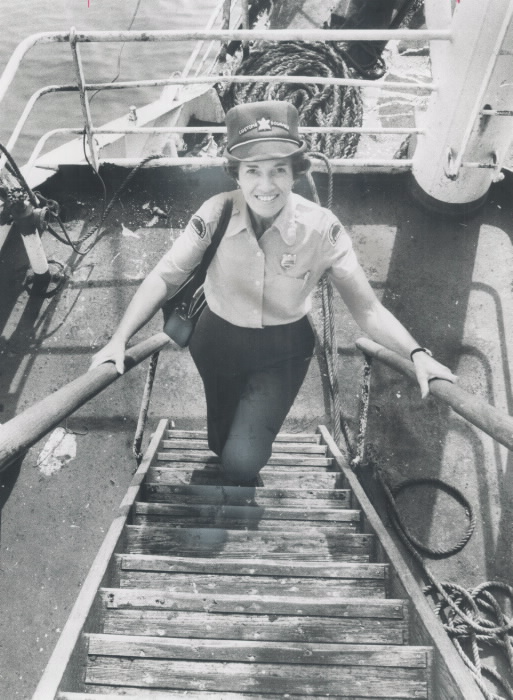 Jean Woolley standing on staris on a pier