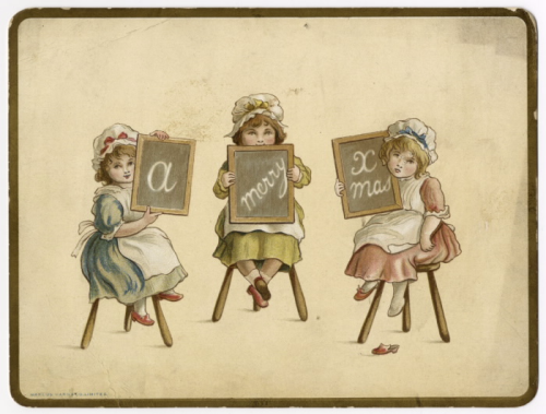 Three girls sitting on stools holding up chalk boards with a holiday message written on it Three girls sitting on stools holding up chalk boards with a holiday message written on it
