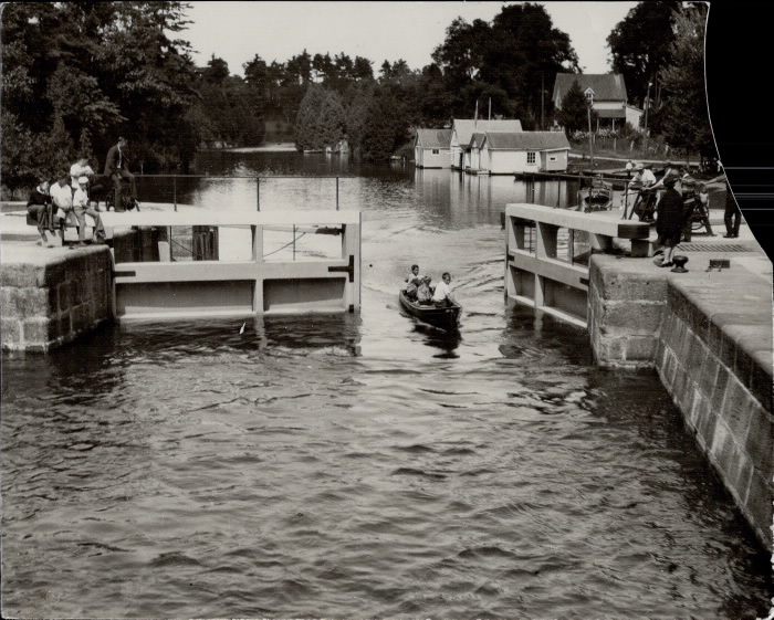 Canoe paddling through the gates of a lock on the Rideau Canal.