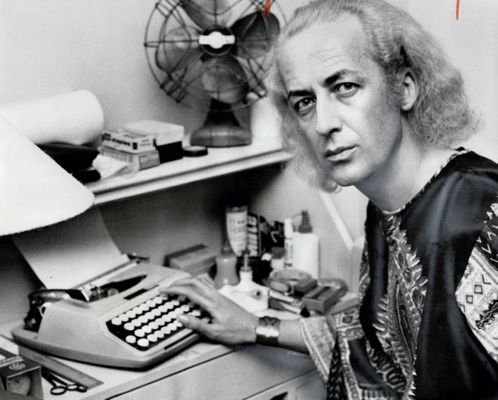 John Herbert, playwright of Fortune and Men's Eyes, sits at a typewriter in his Toronto apartment, 1970