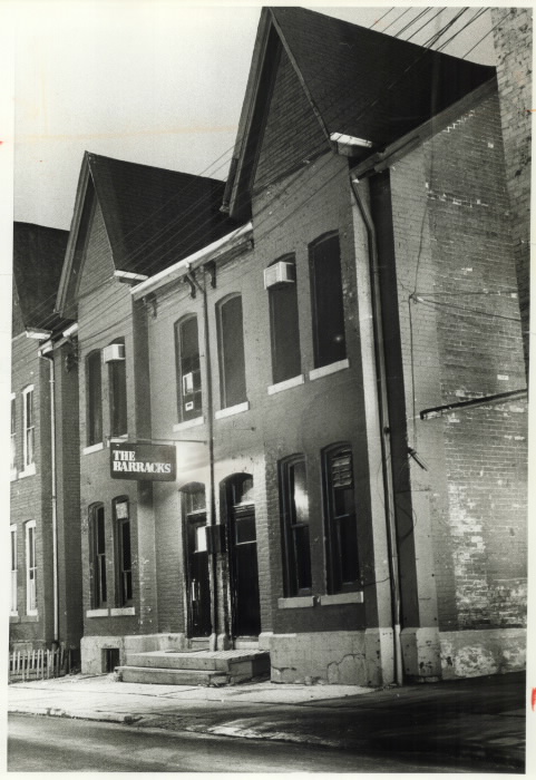 1978 photo of The Barracks, one of four men's bath houses raided by police in 1981