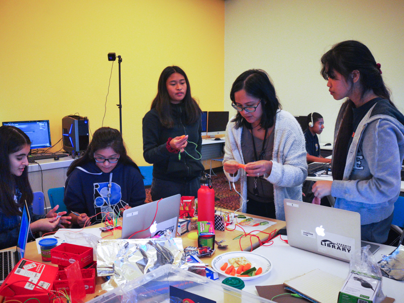 Teens working on a tech program at Malvern Branch