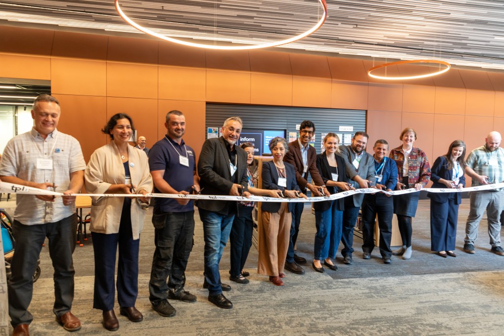 Ribbon cutting at the grand opening celebration of Junction Triangle branch