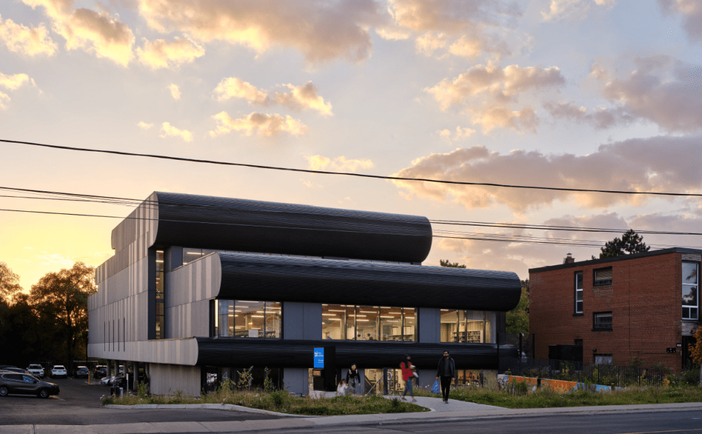 Exterior of a library with customers outside.