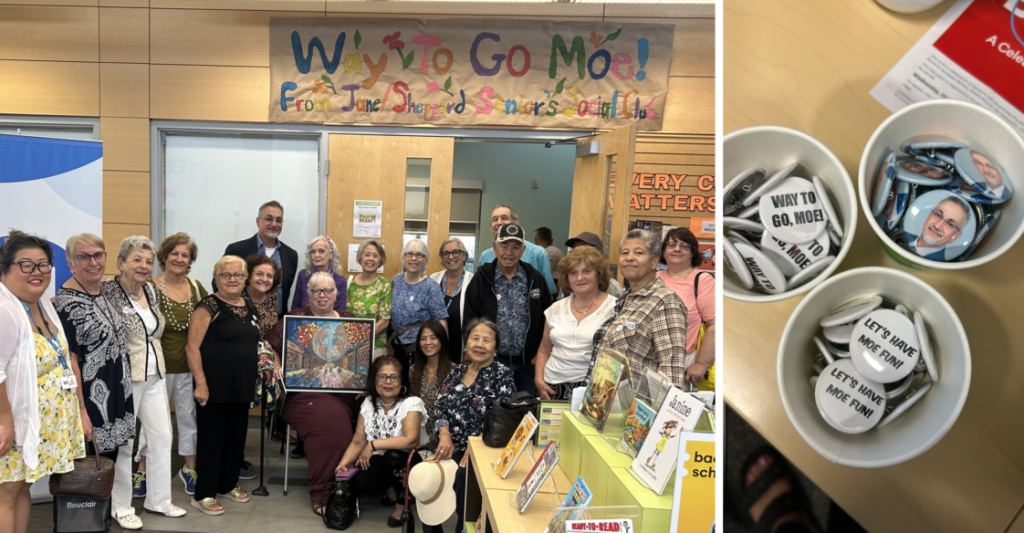 Moe in a library with a large group of staff and seniors. Button pins with Moe's face and congratulatory phrases.